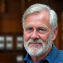 Portrett av Martin Dahl, en mann i 50-årene med skjegg, alvorlig og fokusert uttrykk